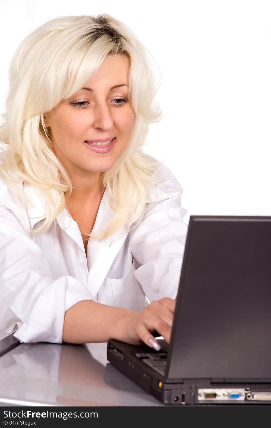 Blond woman working with laptop