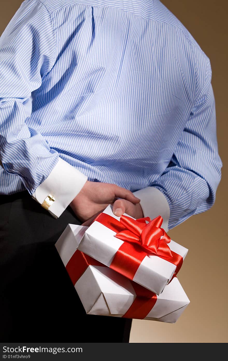 Man holding fine wrapped gift box