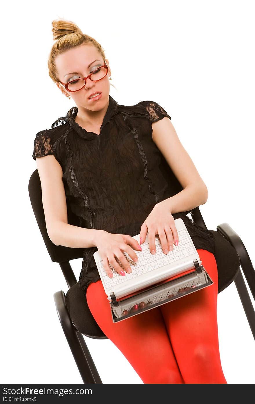 Beautiful girl in chair with laptop. Isolated