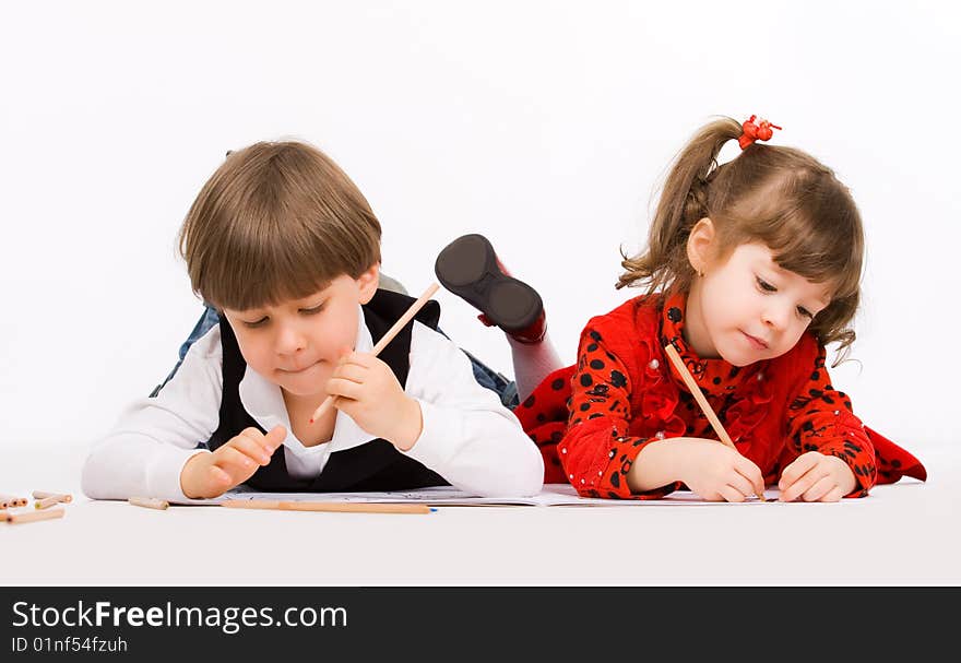 Children drawing with pencils over white. Children drawing with pencils over white