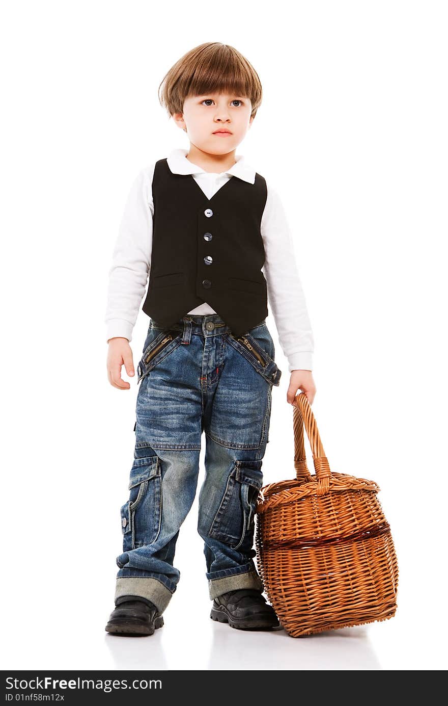 Handsome little boy holding basket, isolated on white