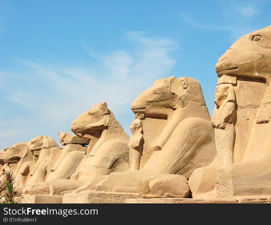 Alley of the ram-headed sphinges in front of the Temple of Amun-Ra at Karnak. Antique Thebes. Location: Luxor, Egypt.