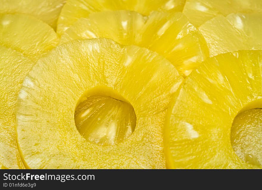 Background made from sliced pineapples. Background made from sliced pineapples