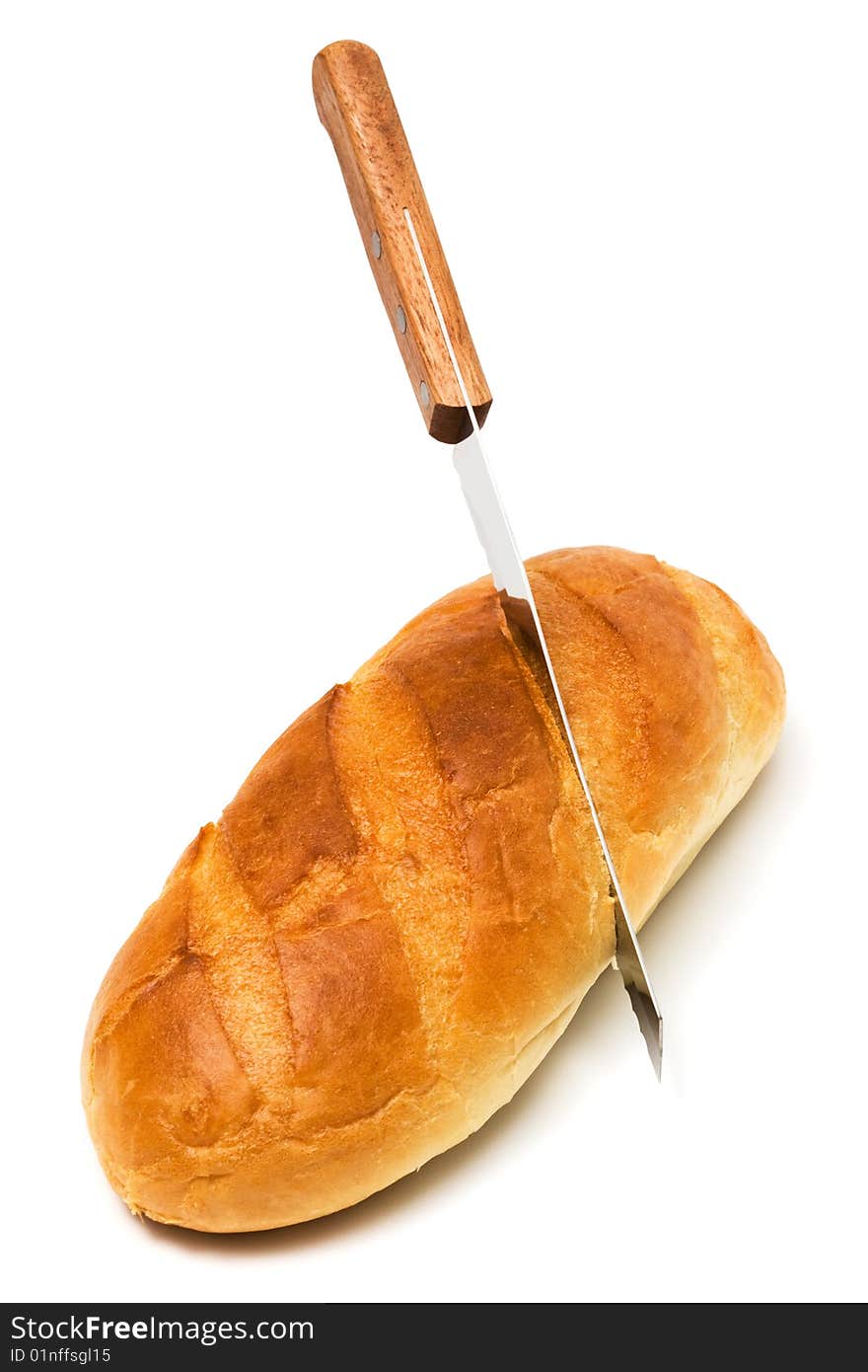 Fresh bread and knife on a white background