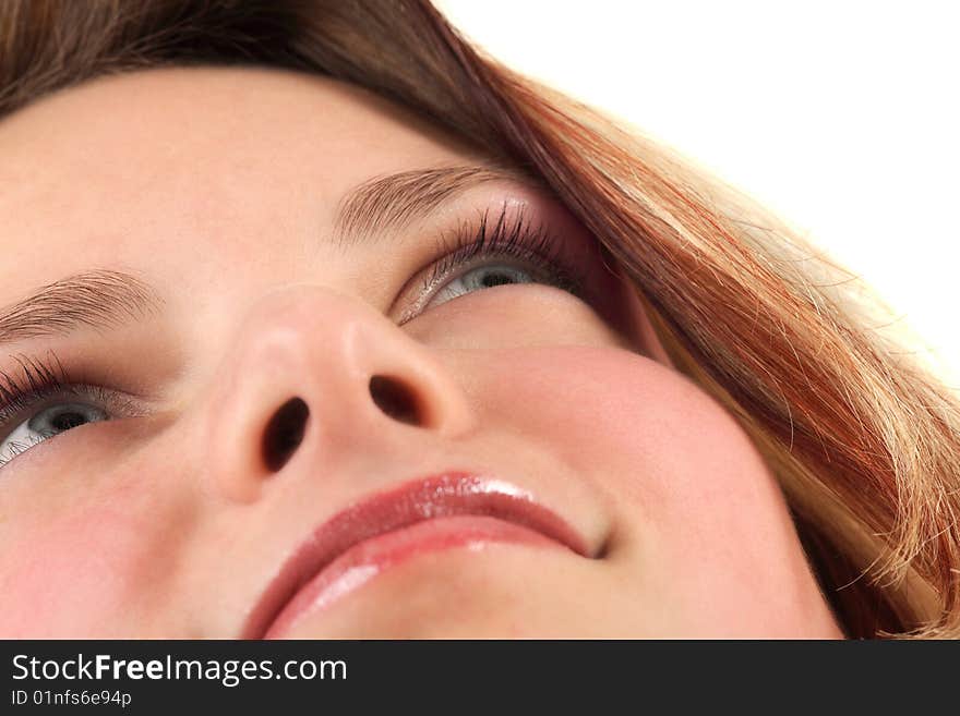 Close-up portrait of young woman's face, studio shot