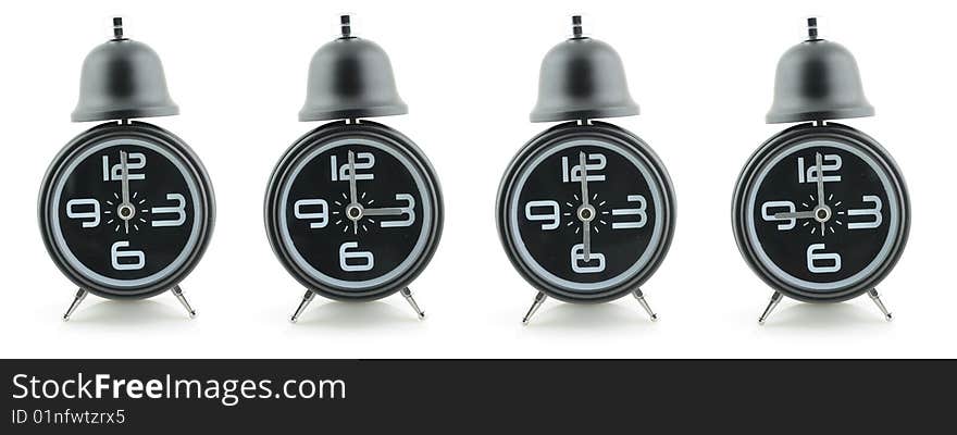 Black alarm clocks in isolated white background