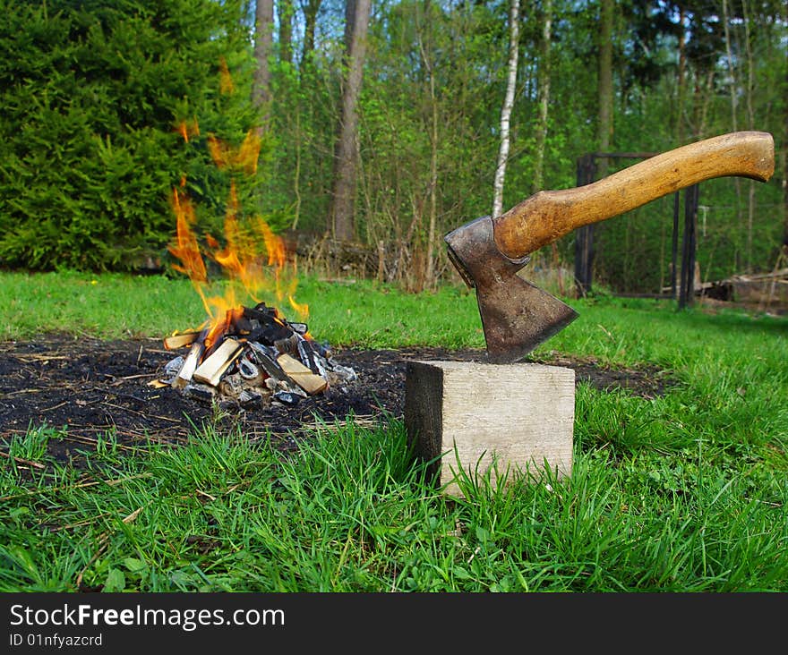 The beginning of picnic. An axe and a fire. Showing of power. The beginning of picnic. An axe and a fire. Showing of power