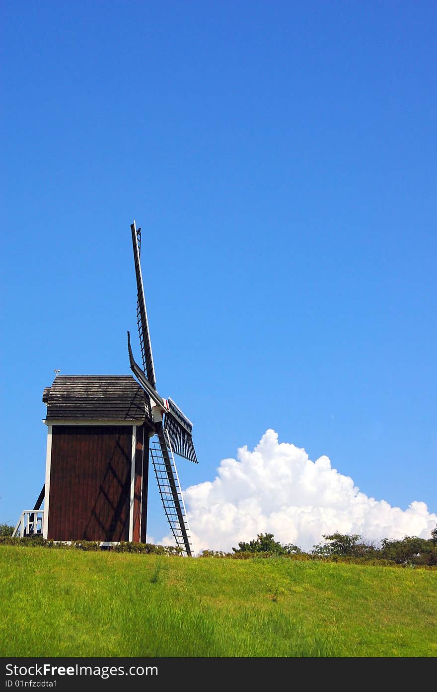 The windmill on a grass land with sky in Kyushu