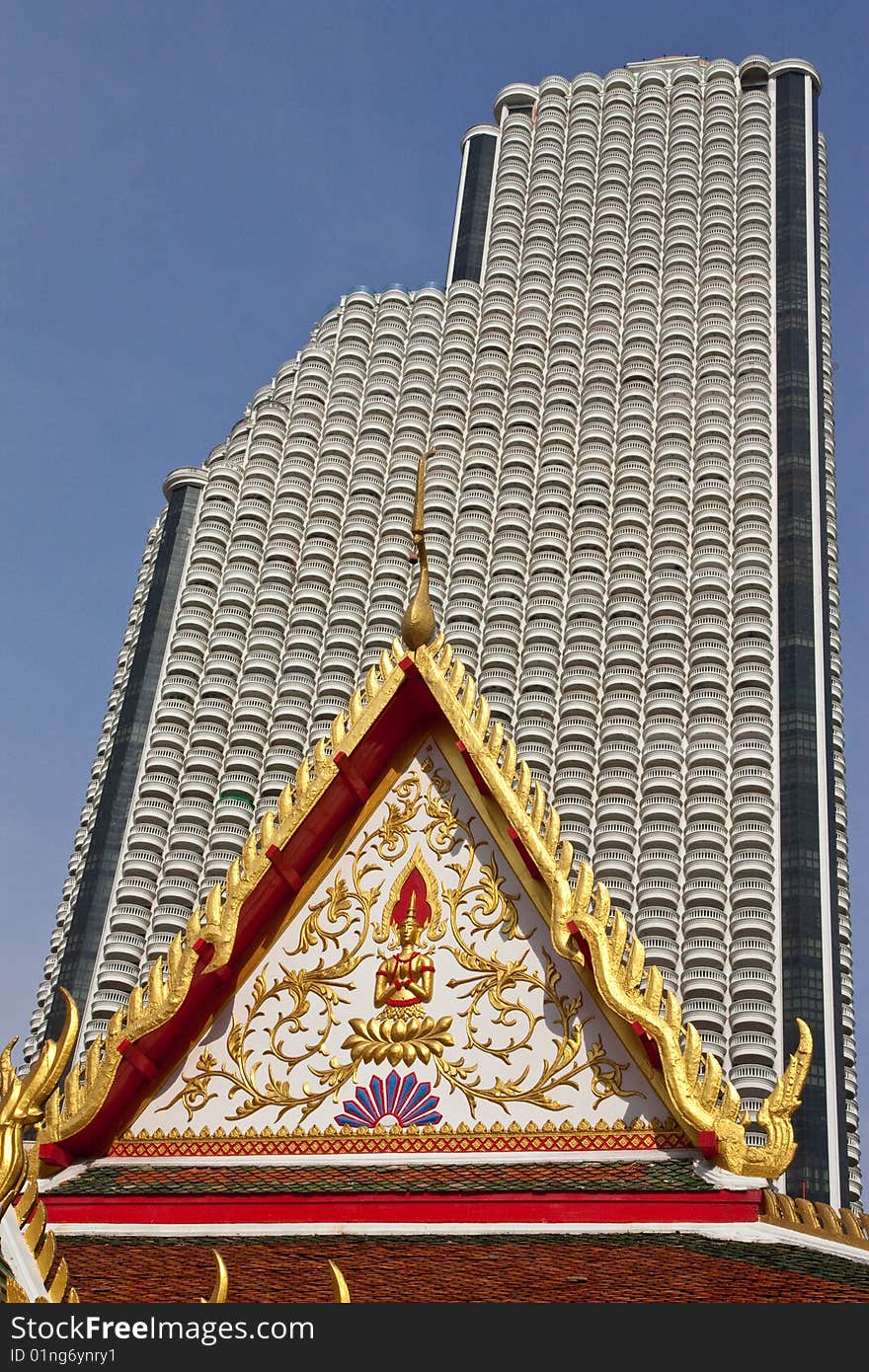 Modern huge building behind pavilion of Wat Suan Plu, Bangkok, Thailand. Modern huge building behind pavilion of Wat Suan Plu, Bangkok, Thailand