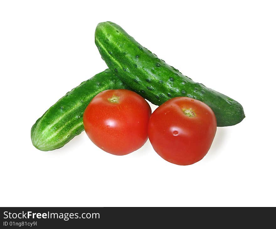 Tomatoes and cucumbers isolated on a white