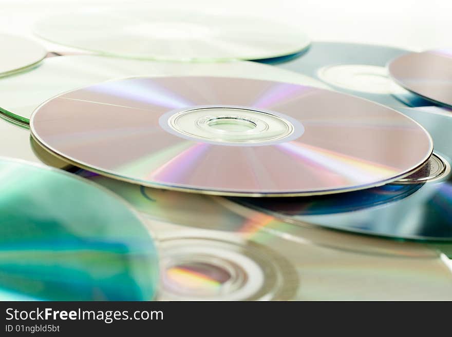 Close up of dvd discs as background, rainbow reflection