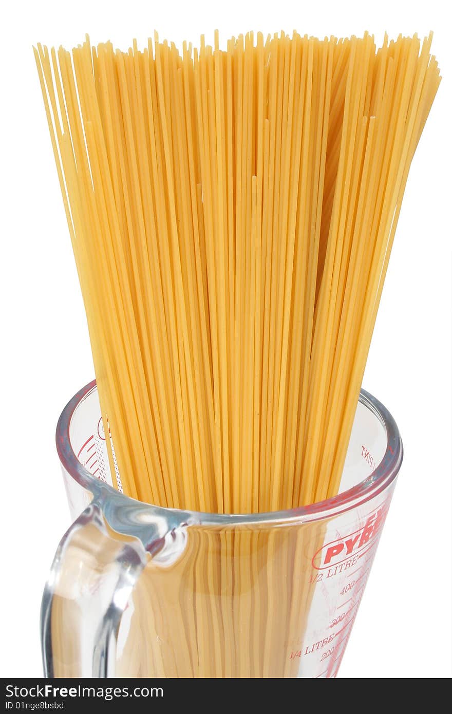 Spaghetti in a glass jar on a white background