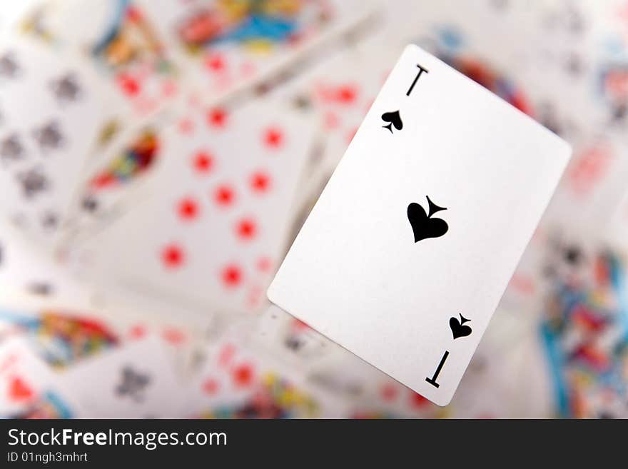 Close-up up of a spades ace over blurred card background