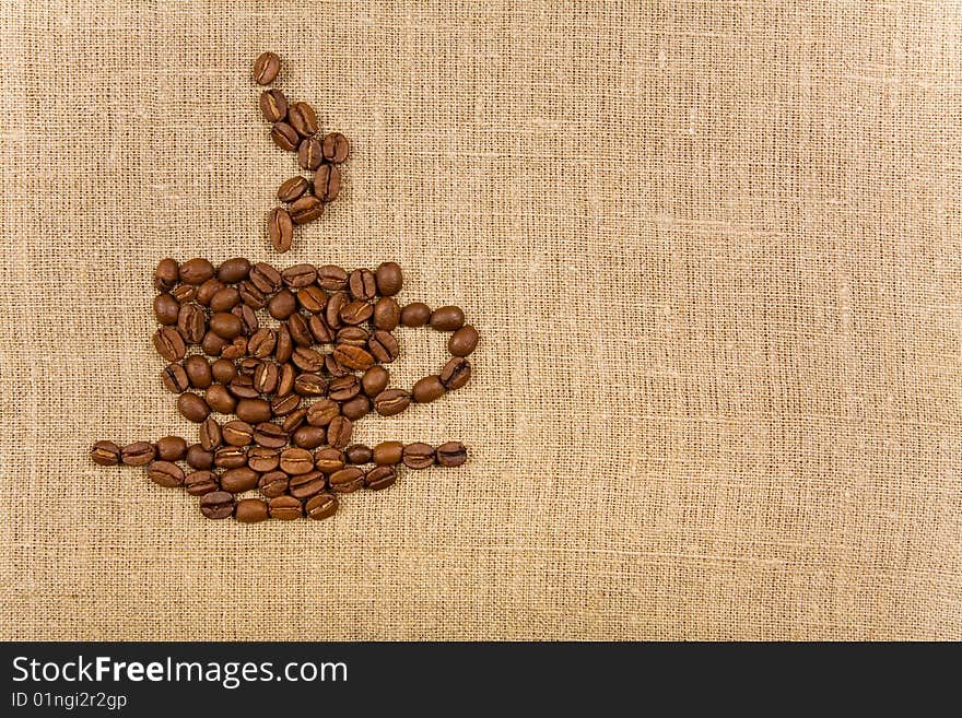 Coffee cup over canvas background