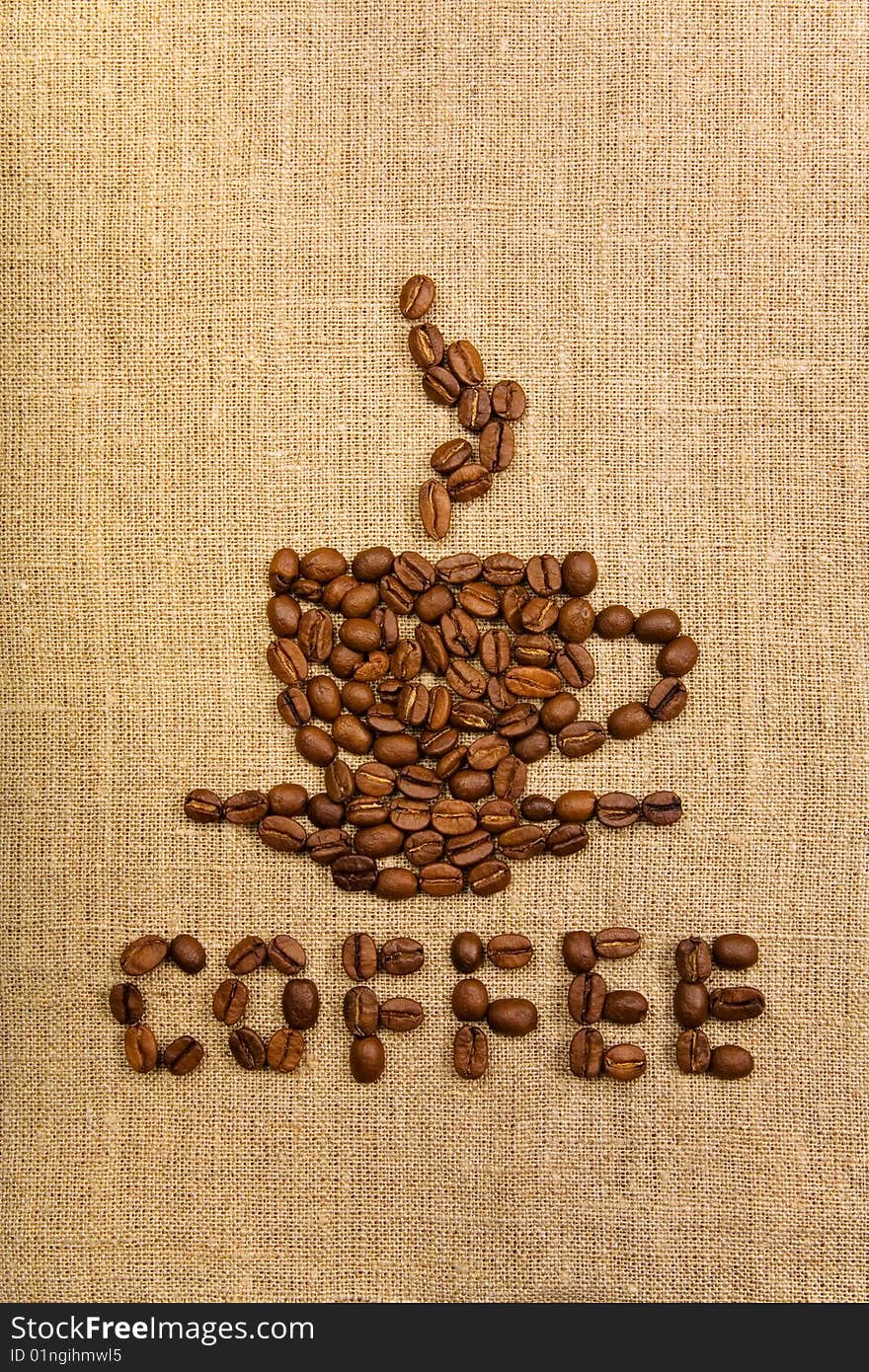 Coffee cup made of beans over canvas background. Coffee cup made of beans over canvas background