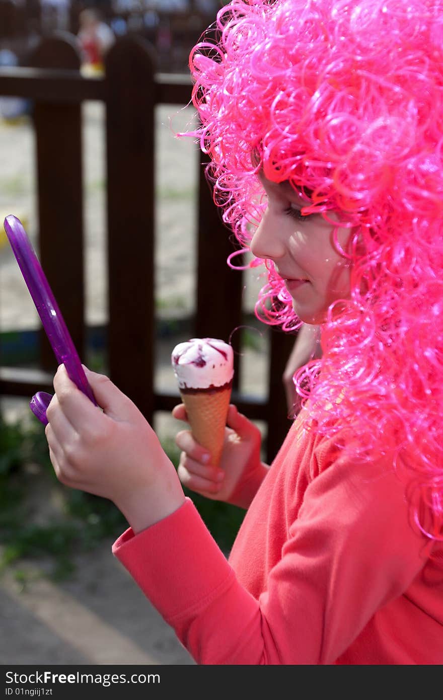 The girl try on purple wig, outdoor. The girl try on purple wig, outdoor