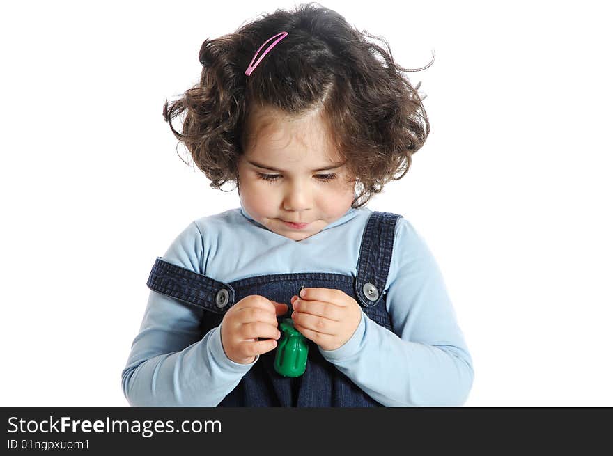 Image of a little girl holding tools isolated on white background