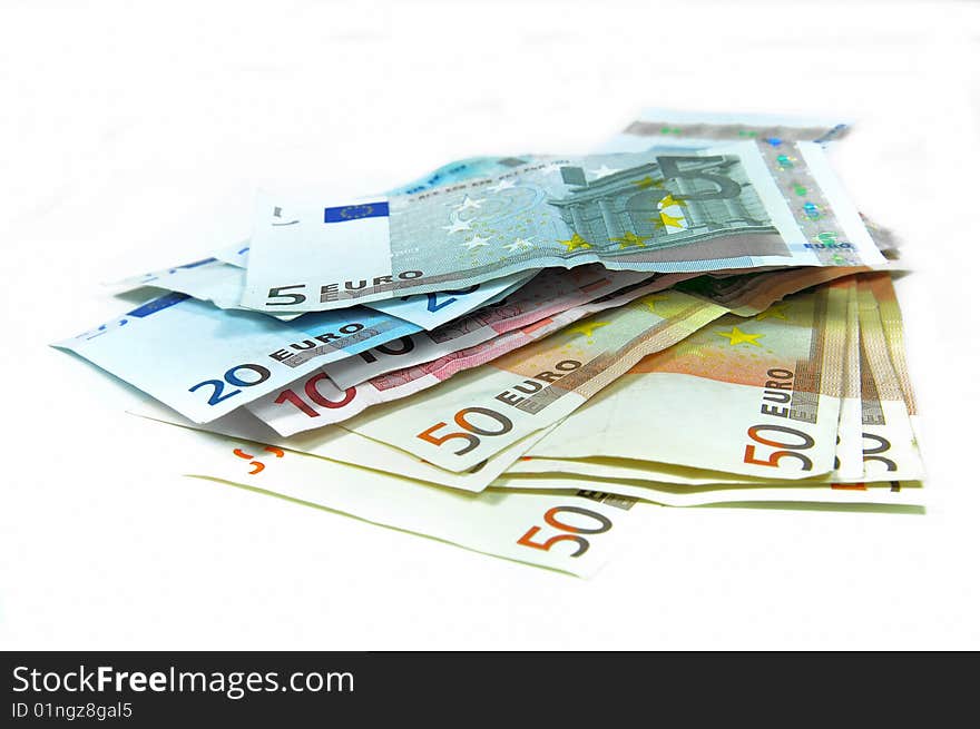 Stack of Euro banknotes isolated on white