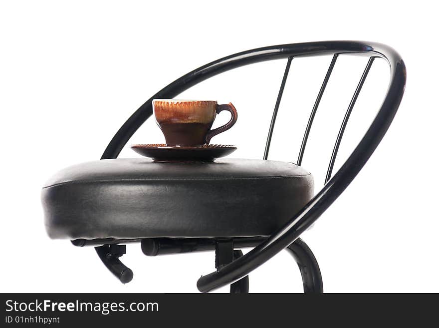 Coffee cup on a bar chair. Isolated over white. Coffee cup on a bar chair. Isolated over white.