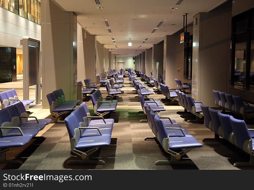 Empty airport lounge by night