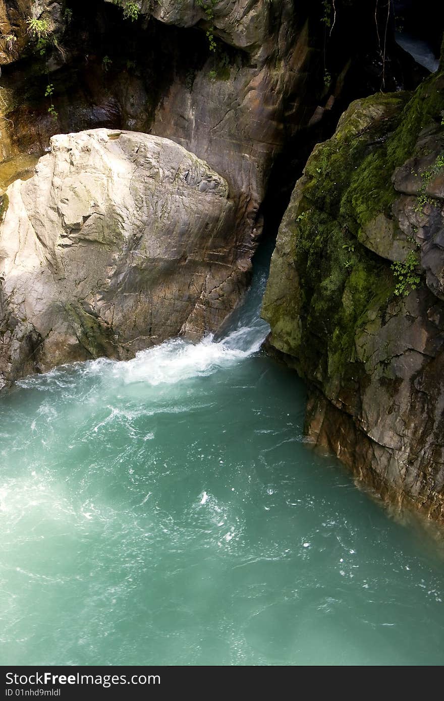 Scroll of a stream between the rocks. Scroll of a stream between the rocks