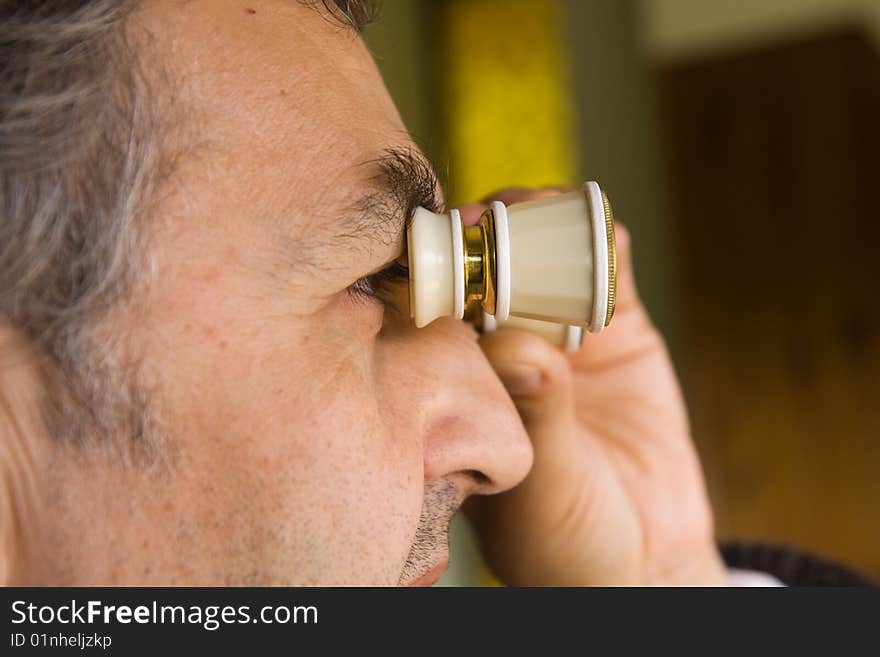 Scientist observing through his microscope. Scientist observing through his microscope