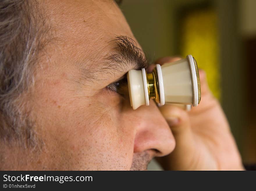 Scientist observing through his microscope. Scientist observing through his microscope