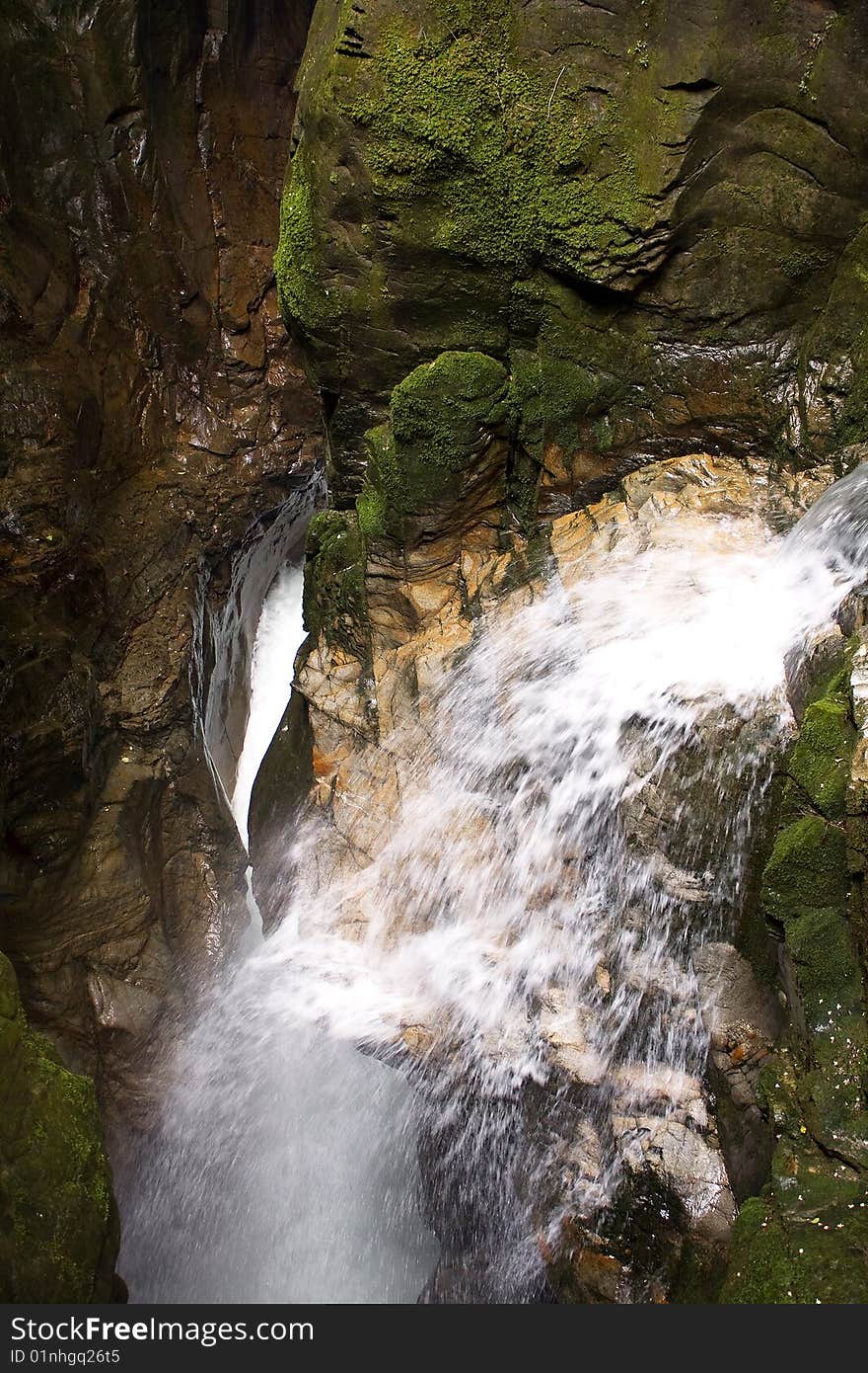 Scroll of a stream between the rocks. Scroll of a stream between the rocks