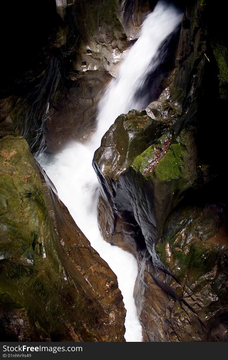 Scroll of a stream between the rocks. Scroll of a stream between the rocks