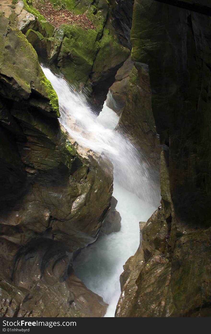 Scroll of a stream between the rocks. Scroll of a stream between the rocks