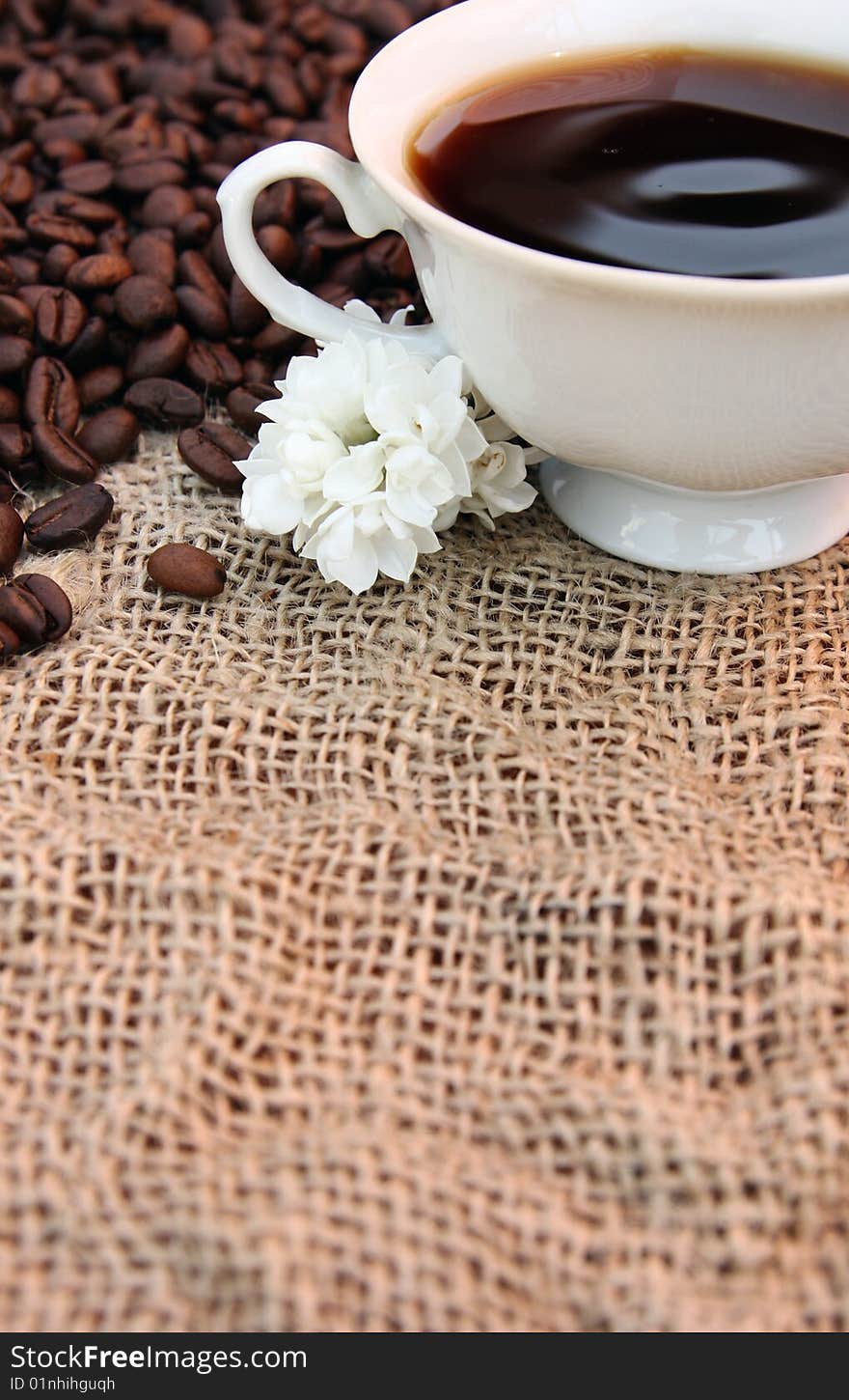 Coffee cup on a burlap fabric. Coffee cup on a burlap fabric