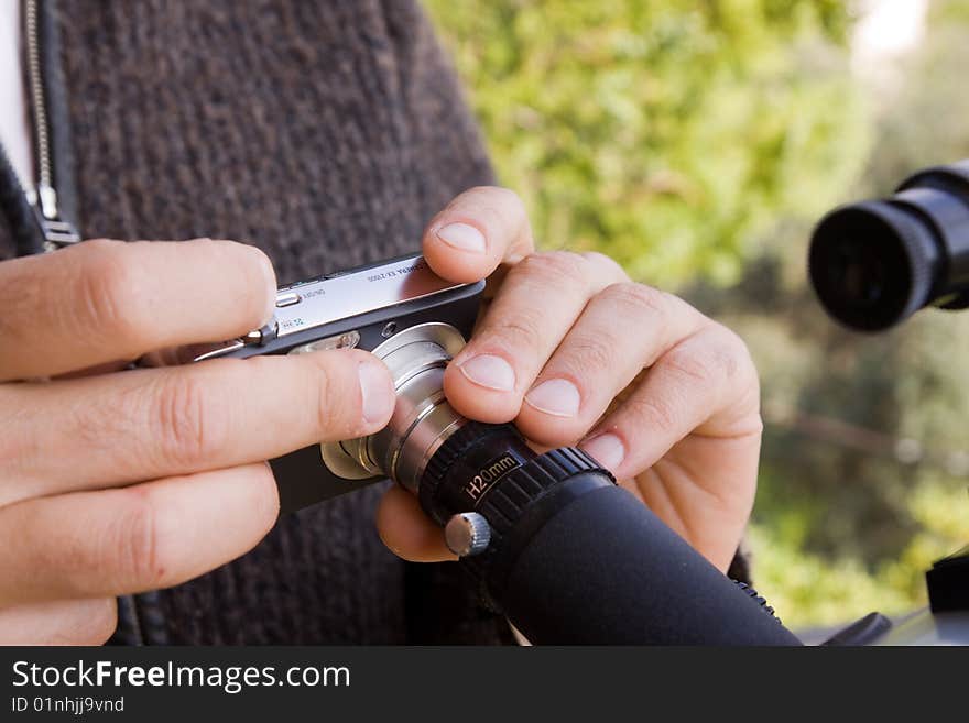 Scientist observing through his microscope. Scientist observing through his microscope