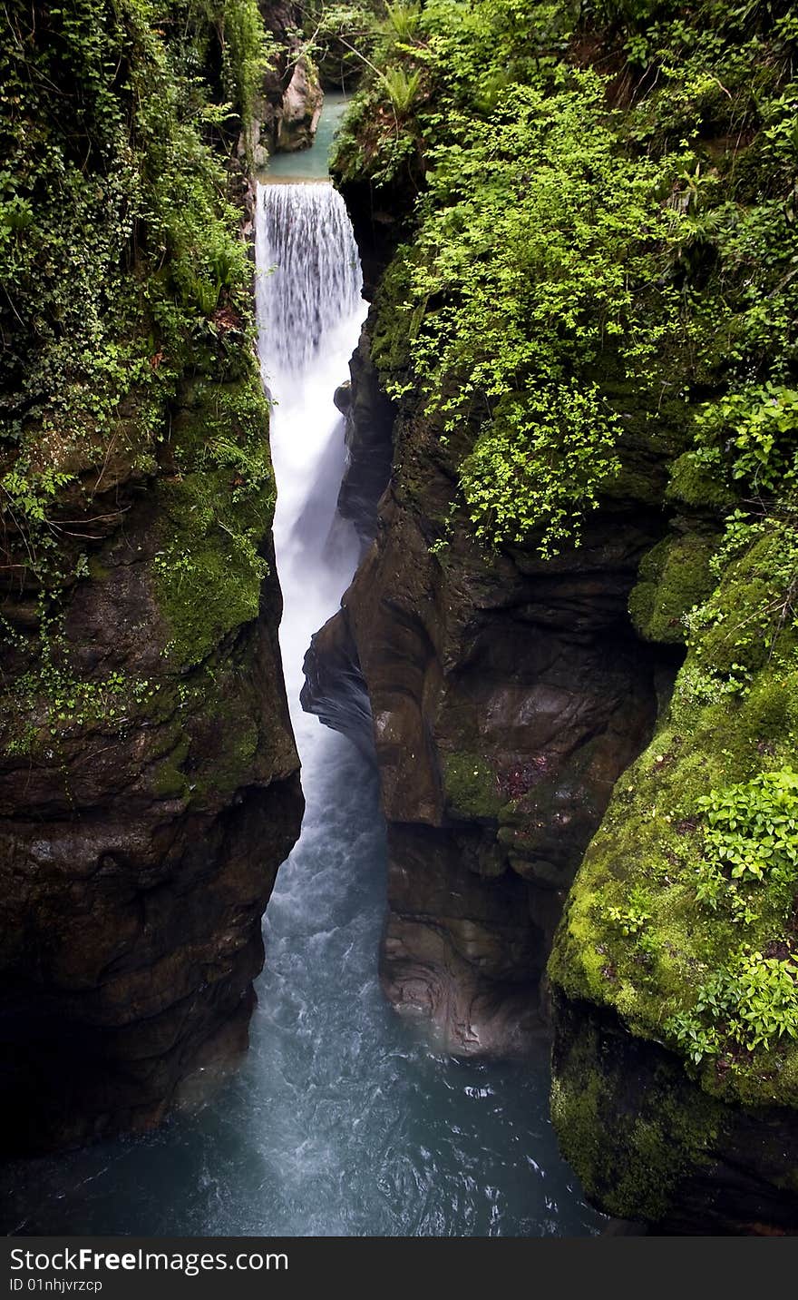 Scroll of a stream between the rocks. Scroll of a stream between the rocks