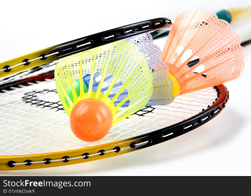 Badminton racquets with shuttlecock on white background. Badminton racquets with shuttlecock on white background