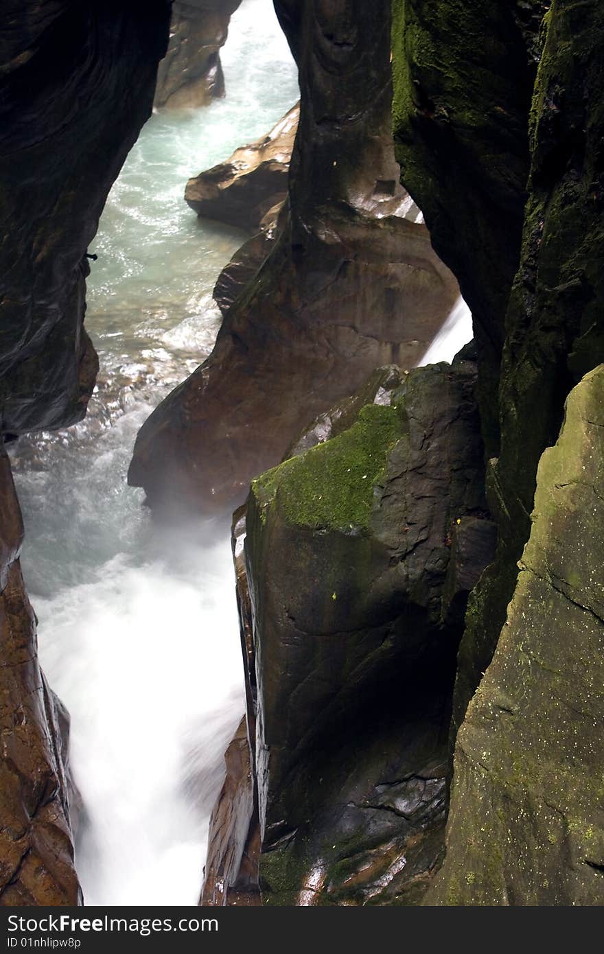 Scroll of a stream between the rocks. Scroll of a stream between the rocks