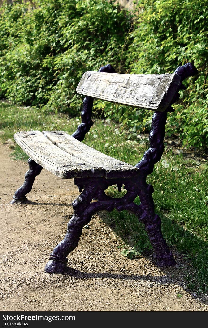 Old bench wooden and  ferrous in park