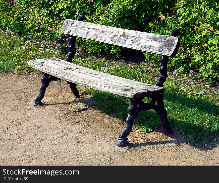 Old bench wooden and  ferrous in park