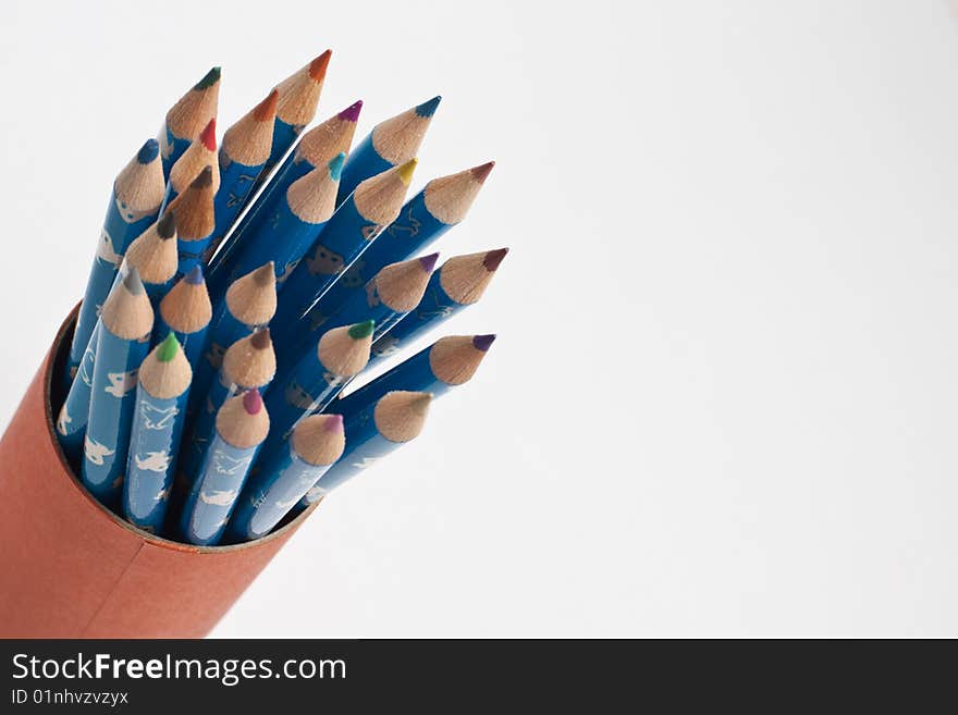 Stack of wooden crayon inside a tube case. Stack of wooden crayon inside a tube case