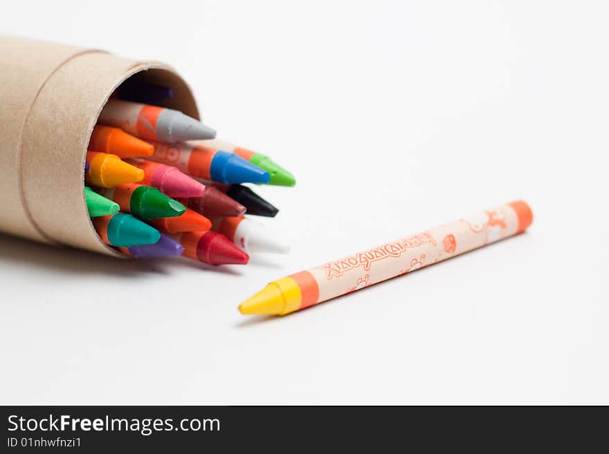 Various colors of wax crayons inside tube case. Various colors of wax crayons inside tube case