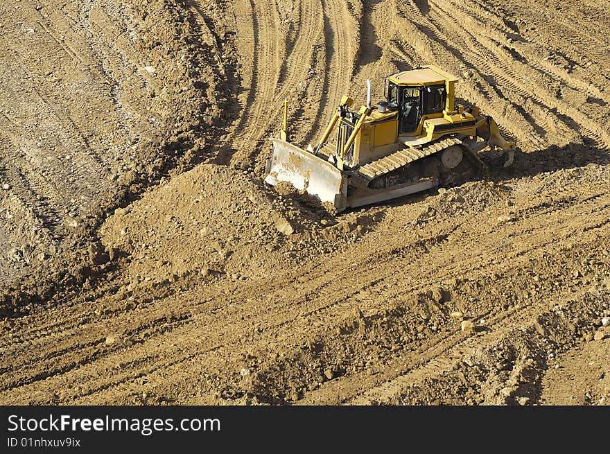 Bulldozer is working in a mine