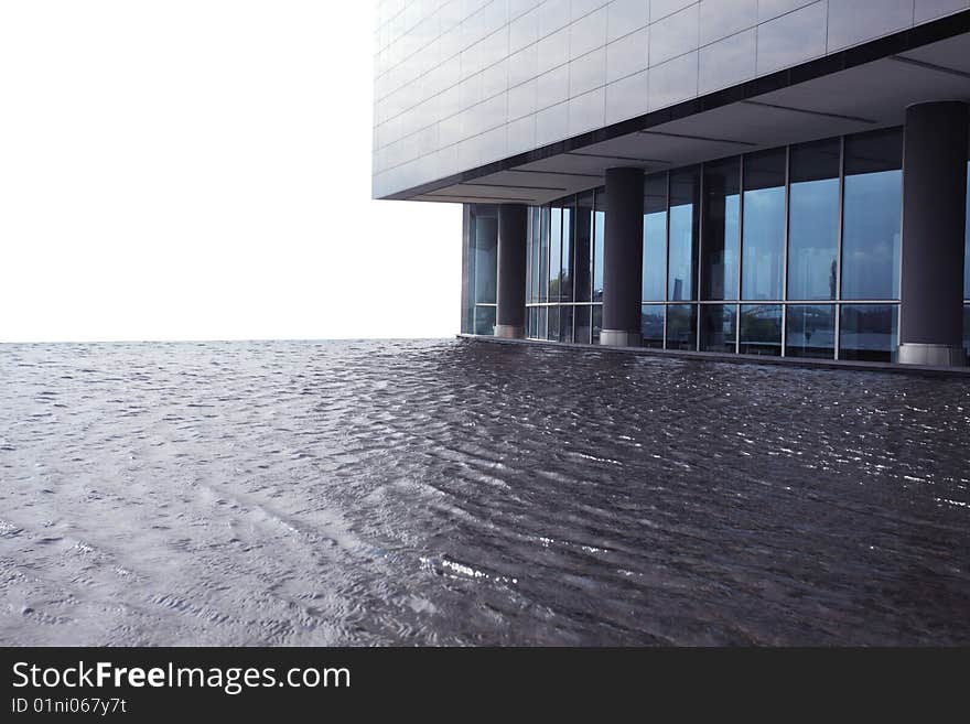 Modern building with swimming pool on a white background