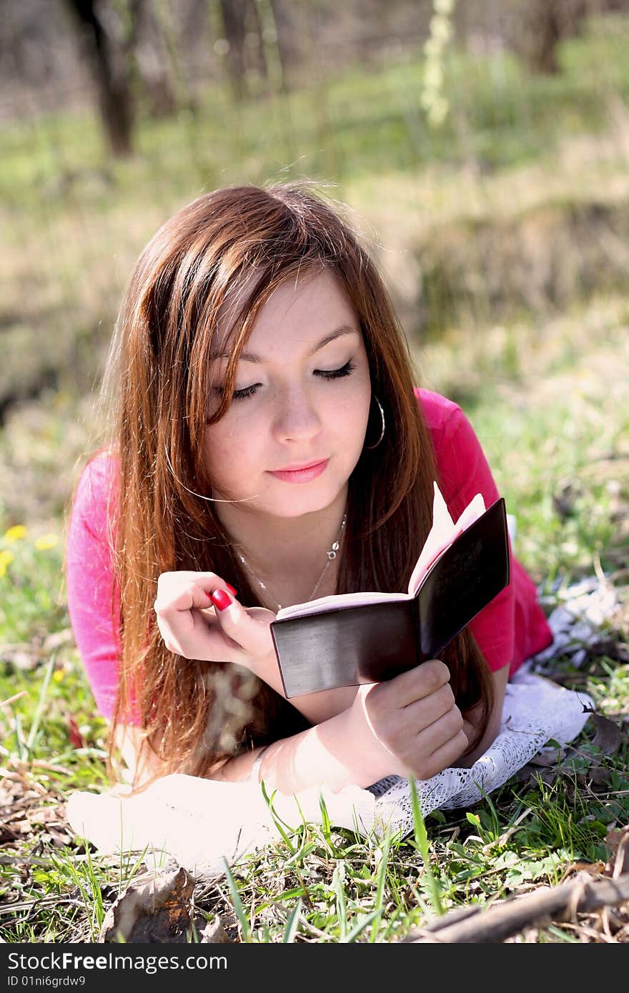 The girl reads the book