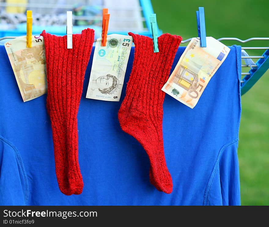 Two red socks and some banknotes. Two red socks and some banknotes