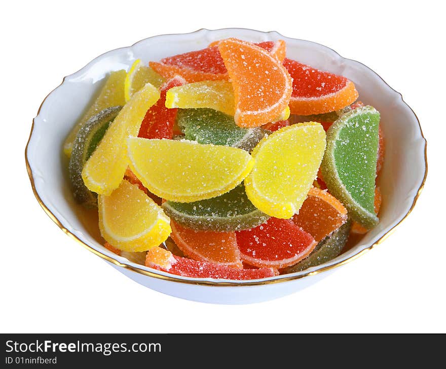 Colorful candy in the white plate