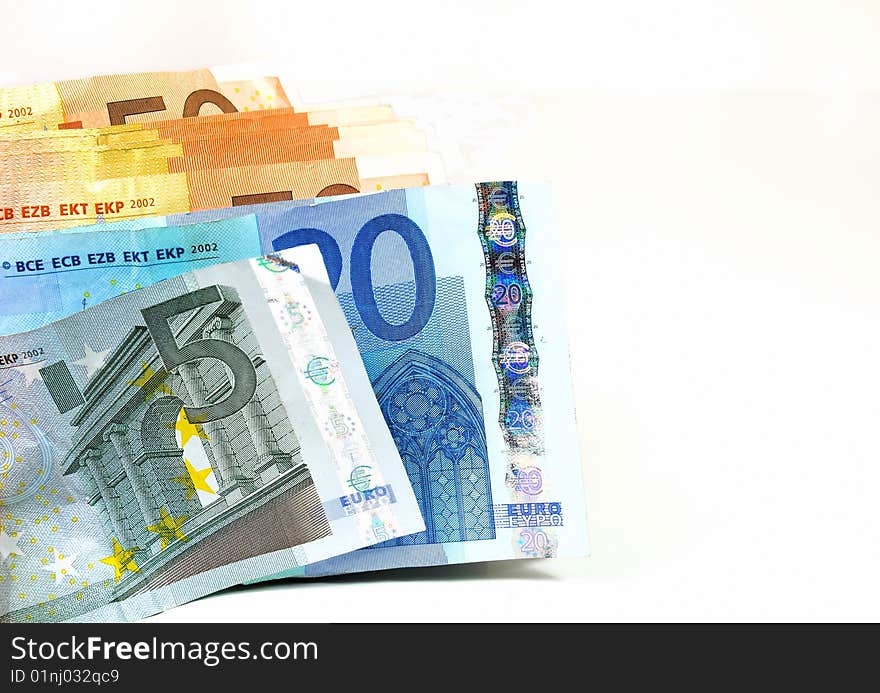 Stack of Euro banknotes isolated on white