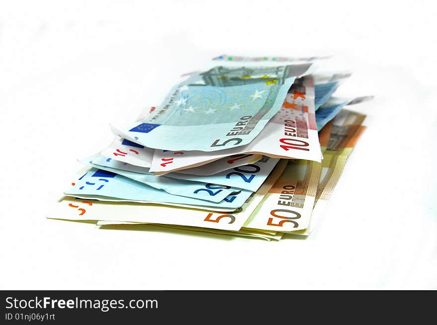 Stack of Euro banknotes isolated on white