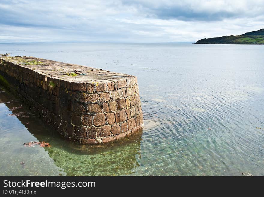 View of Brodick old harbour showing the left had Quay side as it just out in to the sea