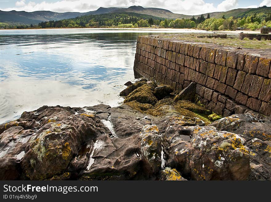 View of Brodick old harbour showing the left had Quay side as it just out in to the sea