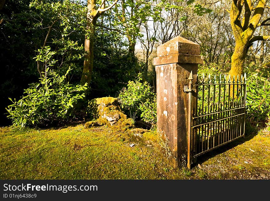 Sandstone gate post and old gate to cemetery. Sandstone gate post and old gate to cemetery