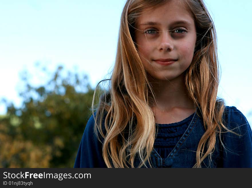 Beautiful Little Girl Smiles at the Camera